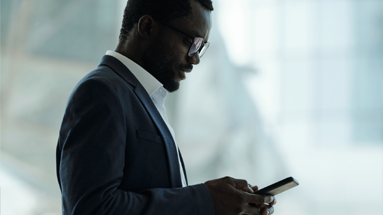 Executive working with his mobile device