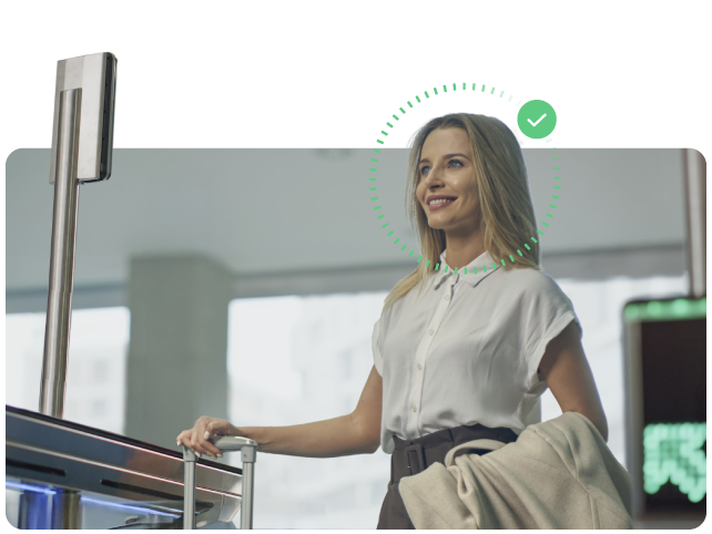 Traveler authenticating her identity using facial recognition