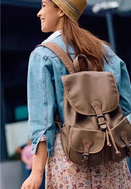 Female traveler walking with a backpack