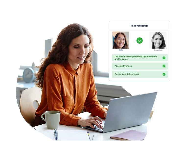 User confirming her identity from a laptop with the Facephi Identity Platform application.