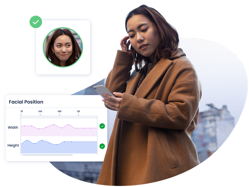User looking at her cell phone. A graphic shows the facial verification process