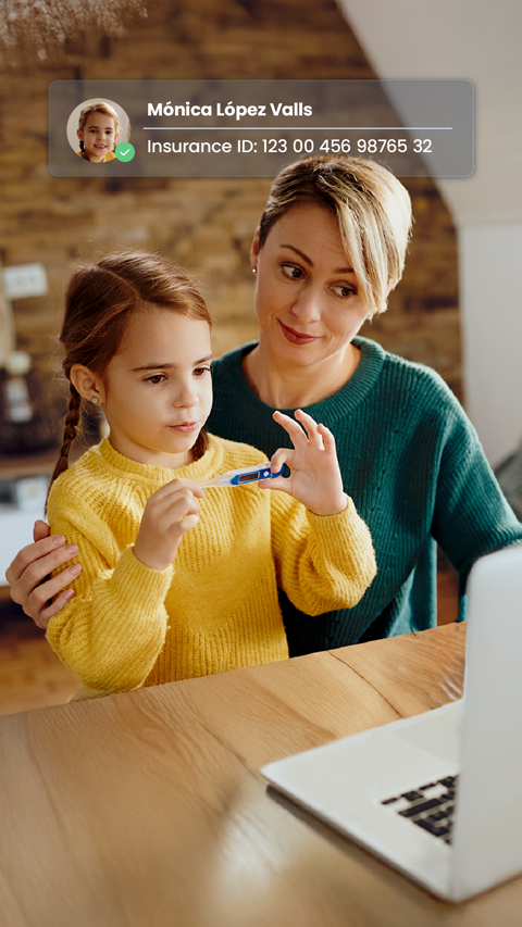 A mother and daughter (the latter holding a thermometer) in front of a laptop. A floating window shows that the mother has authenticated through her insurance