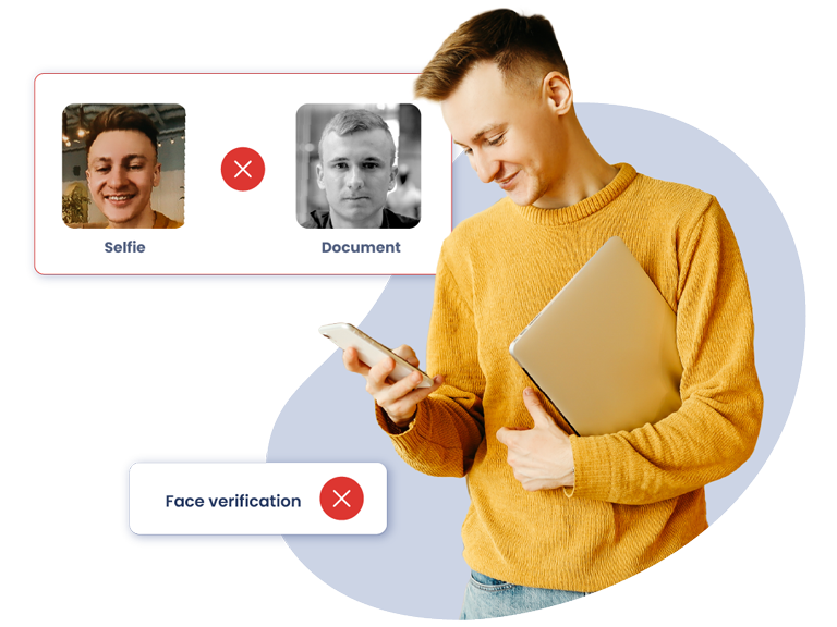 User with laptop under his arm and cell phone in his hand tries to authenticate himself. The platform detects, through facial verification, that he is not who he claims to be