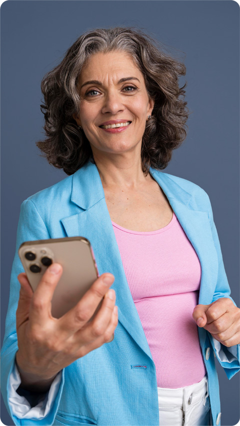 Middle-aged woman holding a mobile in her hand