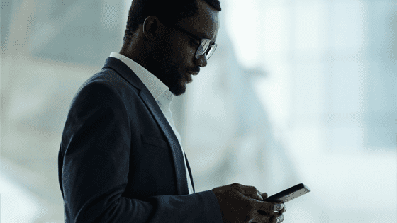 Executive working with his mobile device